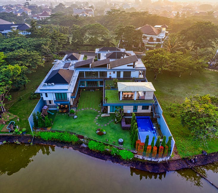 Stunning aerial view of a luxury villa by the river in Tangerang, Indonesia.